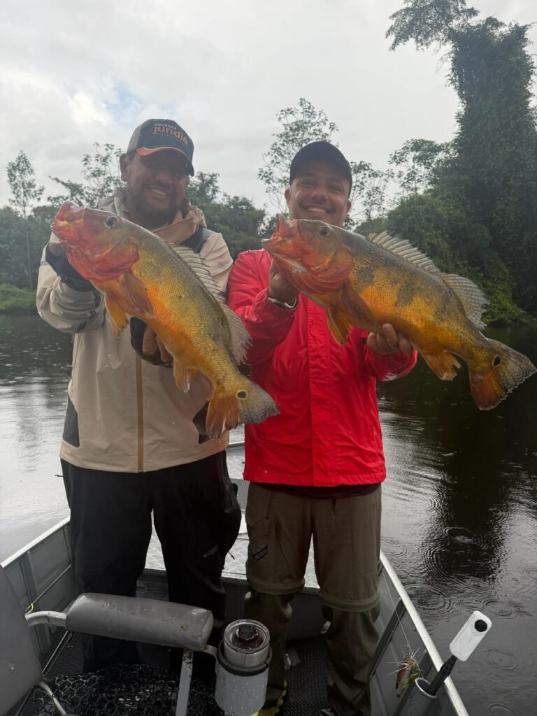 Guest holding a fish caught in the river