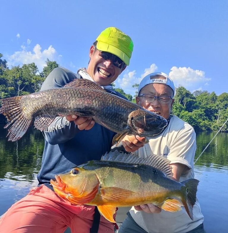 Guest holding a fish caught in the river