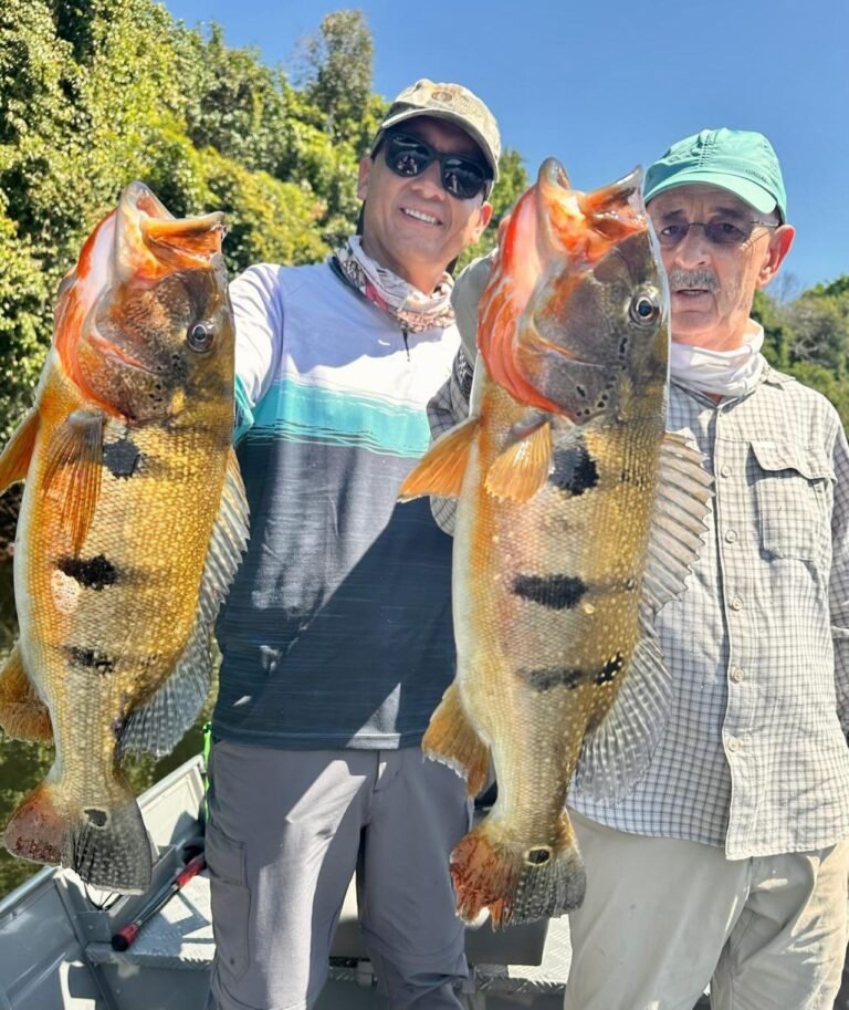 Guest holding a fish caught in the river