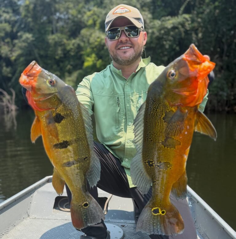 Guest holding a fish caught in the river