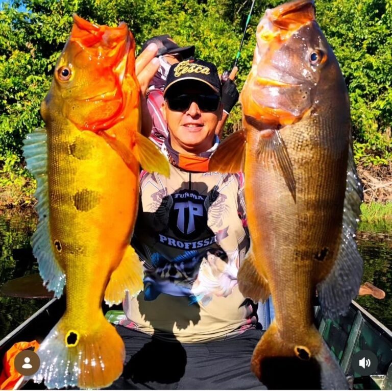 Guest holding a fish caught in the river