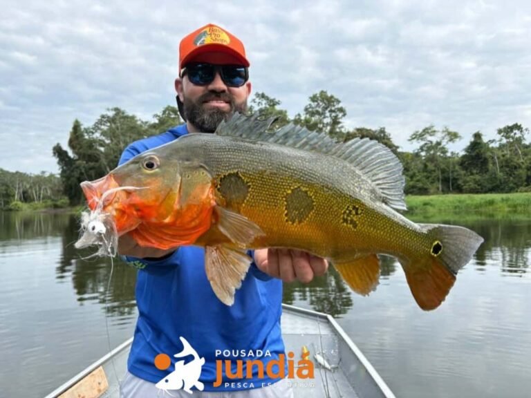 Guest holding a fish caught in the river
