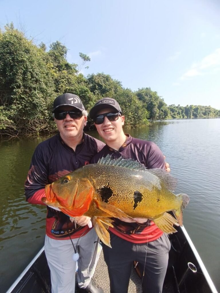 Guest holding a fish caught in the river