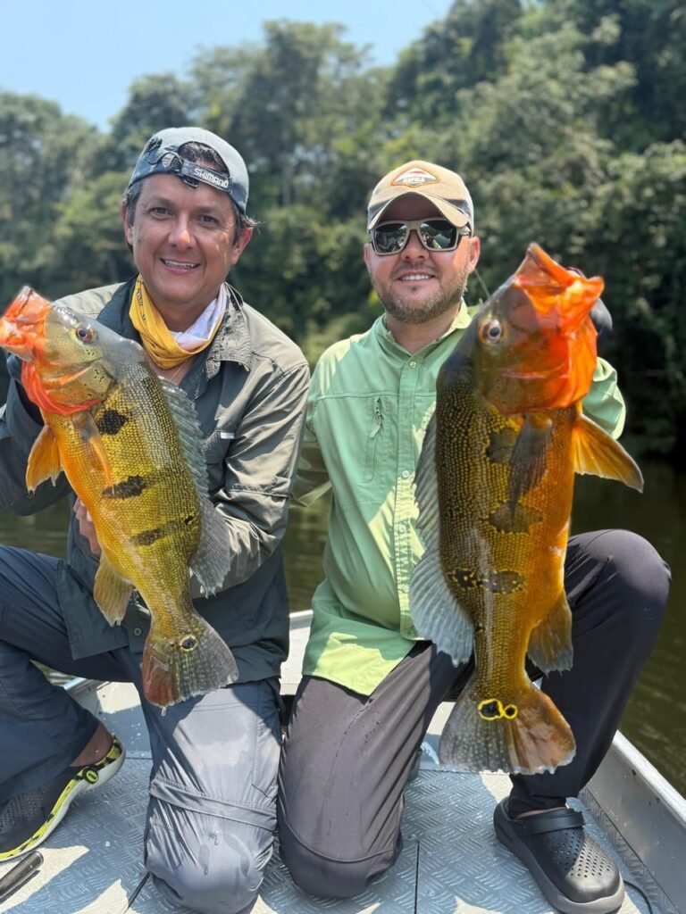 Guest holding a fish caught in the river